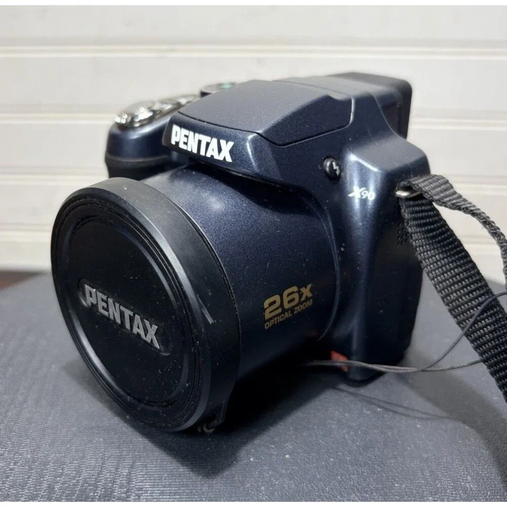 Pentax X90 12.1MP Digital Bridging Camera w/manual, Battery, Charger & Strap